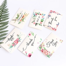 Flat lay of six diverse Thank You stickers featuring elegant typography and green leaves