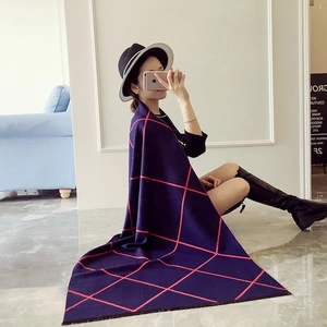 Navy blue and red plaid cashmere-style thick winter scarf for women in modern home setting