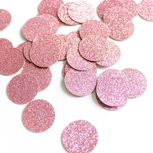 Close-up of sparkling pink glitter confetti dots for graduation table decorations