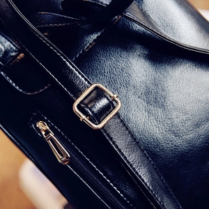 Black leather backpack featuring high-quality texture with gold metal buckle and zipper