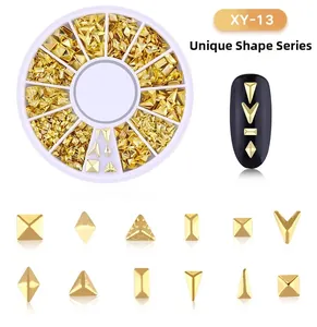 Detailed view of XY-13 golden metal nail art charms in a 12-grid rotating storage box