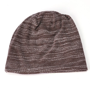 Detailed texture of brown and white mixed-color knit beanie with retro variegated pattern