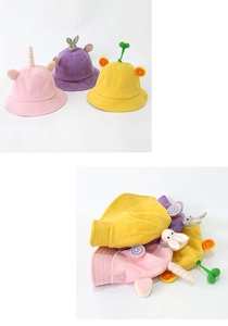 Detail view of corduroy kids sun hats with unicorn horns, bunny ears and sprout decorations