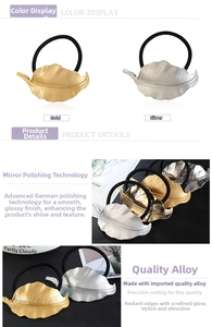 Detailed view of alloy leaf hair ties in polished gold and silver metallic finishes
