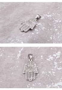 Detailed views of silver Hamsa hand pendant with hollow-out stainless steel craftsmanship