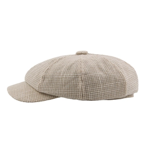 British style newsboy cap with small brown plaid pattern on a clean white background
