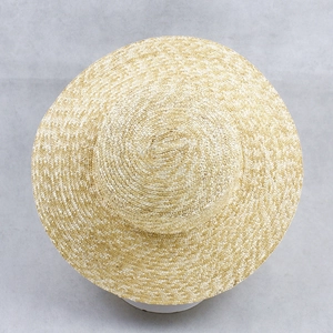 Flat top straw sun hat with wide brim and natural wheat material in beige color