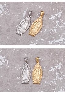 Close-up of gold and silver Virgin Mary pendants on a textured grey background