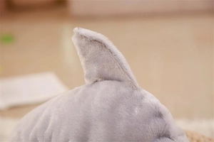 Macro view of plush shark hand puppet dorsal fin showing premium soft gray fabric texture