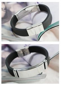 Detail view of mens stainless steel bracelet with black silicone and metal clasp