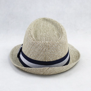 Detailed close-up of woven straw texture and blue-white striped band on sun hat