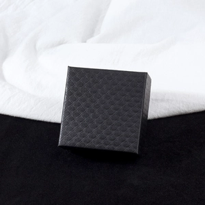 Top view of a 7x7cm black square jewelry box with elegant diamond pattern texture