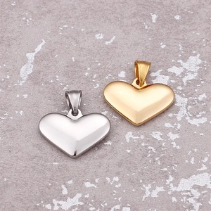 Polished minimalist stainless steel heart-shaped pendants in gold and silver finish