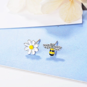 Asymmetric flower and honeybee stud earrings with sparkling crystals and silver plating