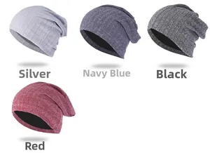 Detailed knit texture display of slouchy beanies in silver, navy, black and red