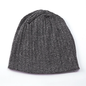 Detailed view of the melange grey knitted beanie featuring ribbed texture and soft fabric