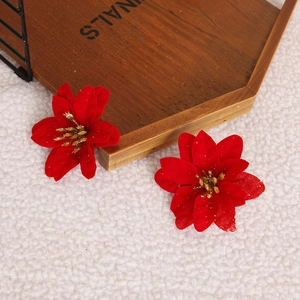 Artificial Christmas poinsettia flowers in vibrant red with gold glitter center accents