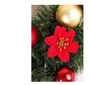 Close-up of red Christmas poinsettia flower with gold glitter and shiny ornaments