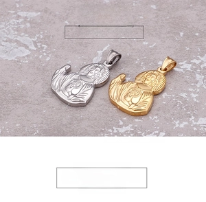 Detailed close-up of religious Jesus Sacred Heart pendants in gold and silver finishes