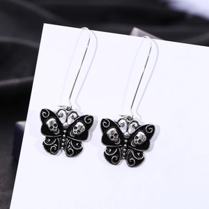 Gothic butterfly drop earrings in vintage silver with black enamel skull details