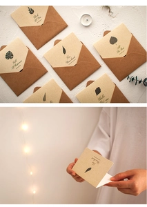 Close-up of six retro kraft paper greeting card sets with various leaf patterns