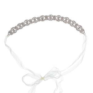 Detail of silver bridal headband with sparkling rhinestones and white satin ribbons