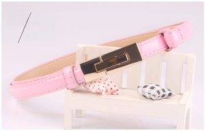 Detailed view of a slim pink patent leather belt featuring a gold rectangular metal buckle