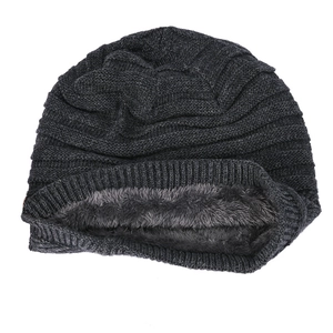 Detail of winter knitted beanie featuring thick fleece lining and dark grey ribbed weave