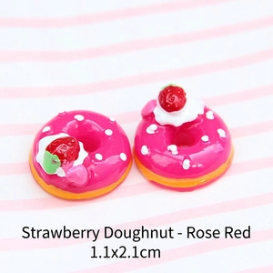 Macro view of rose red strawberry resin donut charm with dimensions 1.1x2.1cm for DIY crafts