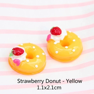 Macro detail of 1.1x2.1cm strawberry donut charms for DIY jewelry and hair accessories