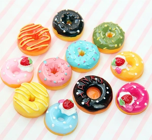 Flat lay of colorful resin donut charms for DIY jewelry and hair accessories craft
