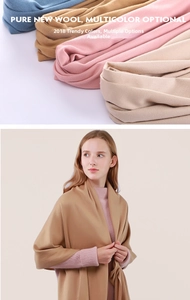 Selection of premium solid wool scarves in multiple colors with fine fringe texture