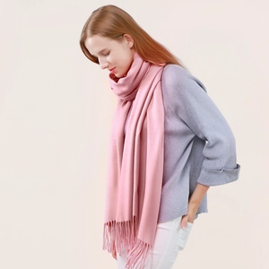 Pink cashmere wool blend scarf with fringe details for winter warmth and versatile styling