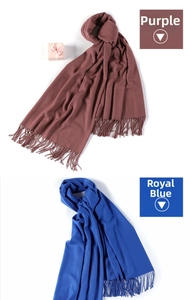 Close-up of soft cashmere wool blend scarf featuring purple and royal blue tassels