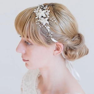 European silver bridal hairpiece with pearls, sequins, and white ribbon for wedding hairstyles