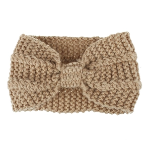 Close-up of thick chunky knit texture and bow knot design on beige ear warmer headband