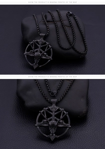 Close-up of a black stainless steel goat head pentagram pendant on a box chain necklace