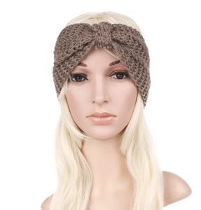 Detail of a brown knitted headband for women featuring a stylish twist knot design