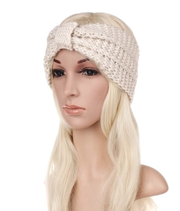 Detail of cream chunky knit twisted headband with warm bohemian winter texture