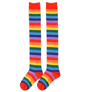 Detail of colorful rainbow striped over-knee high socks with elastic knitted texture