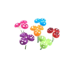 Detail of colorful artificial mushrooms with wire stems for Christmas tree decorations