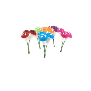 Colorful foam mushrooms on green wire stems for Christmas tree and DIY crafts decoration