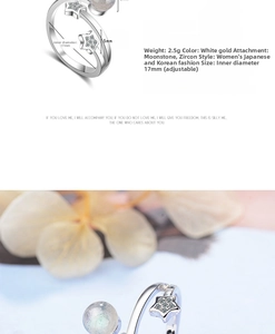 Detailed view of adjustable star ring with moonstone and zircon on floral background