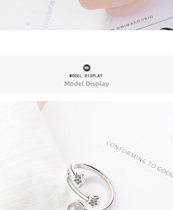 Macro detail of double star open ring with sparkling pavé cubic zirconia inlay
