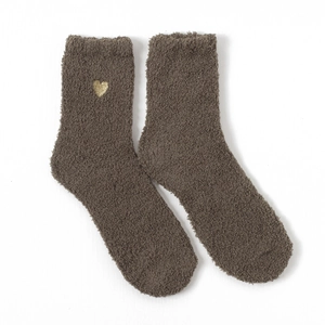 Detail of coral fleece winter socks in dark brown with a gold glitter heart embroidery