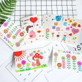 Close-up of floral and heart-shaped Christmas thank you cards set on white grid background
