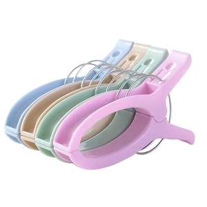 Large plastic windproof clothespins for quilts in assorted pastel colors on white background