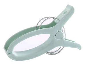 Macro detail of mint green windproof clothes peg with heavy-duty metal spring