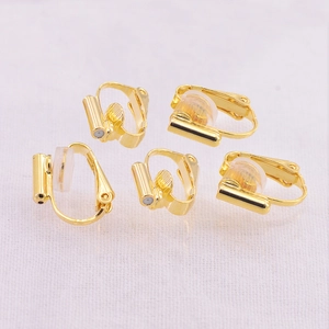 Five gold U-shaped earring converters with screw adjustment and clear silicone pads