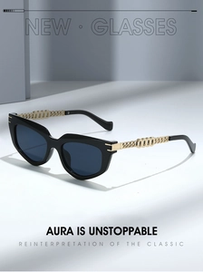 Detailed macro view of the gold-tone metal chain link temples on cat-eye sunglasses